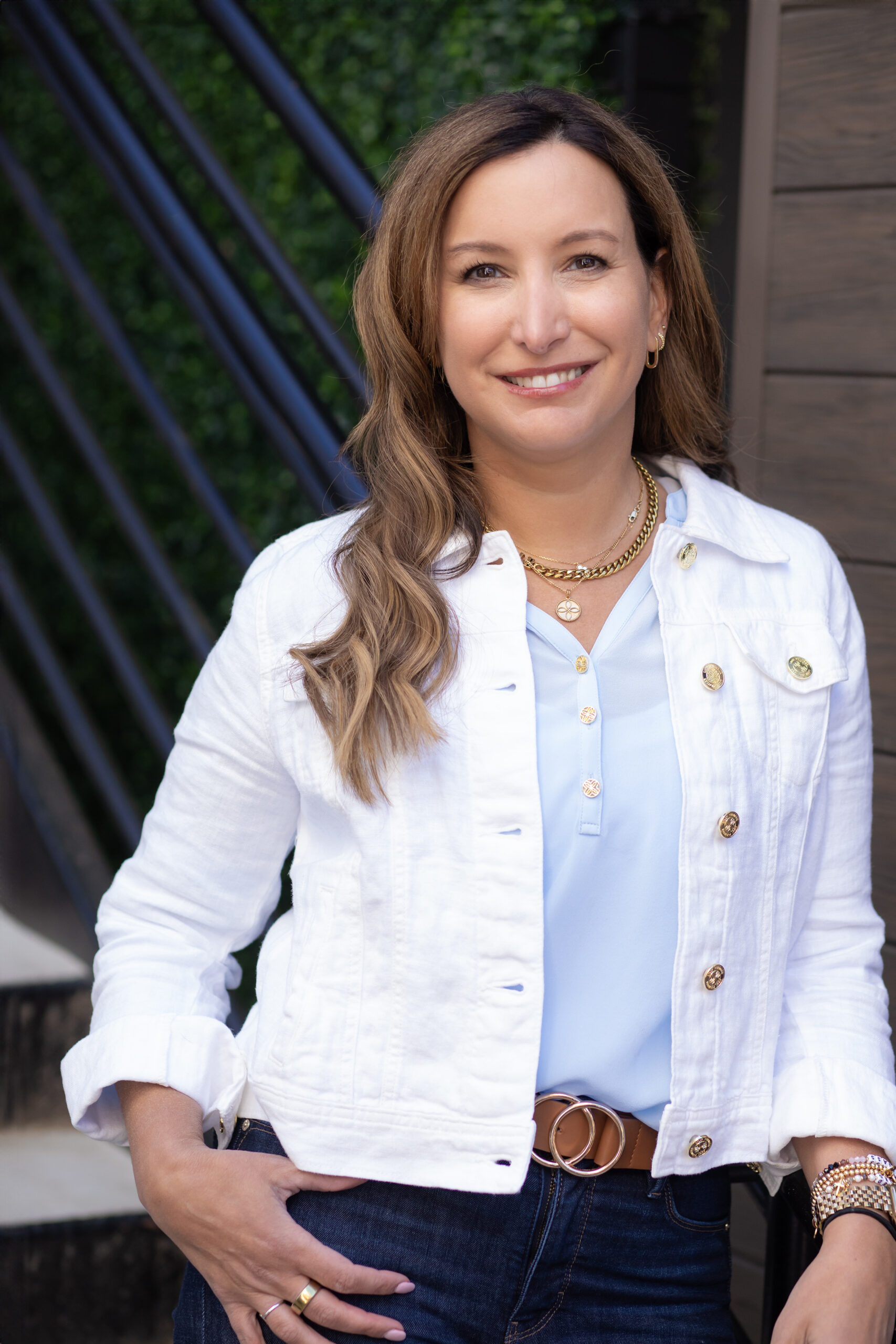 IMG_2363edit A picture of Lynn Bowser wearing a light blue shirt under a white jacket
